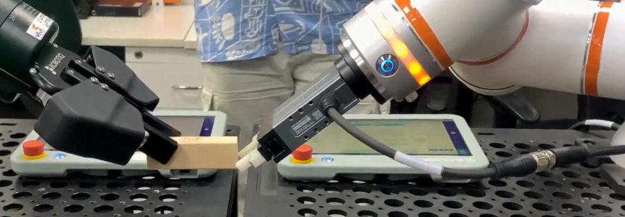 Engineer capturing real-world robotics training data using motion-capture sensors for physical AI