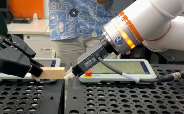Robotics Training Data Collection – Nferent AI Engineer capturing real-world robotics training data using motion-capture sensors for physical AI
