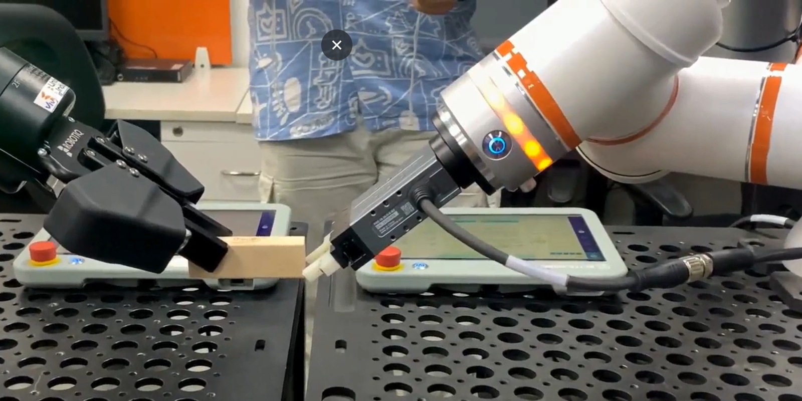 Engineer capturing real-world robotics training data using motion-capture sensors for physical AI